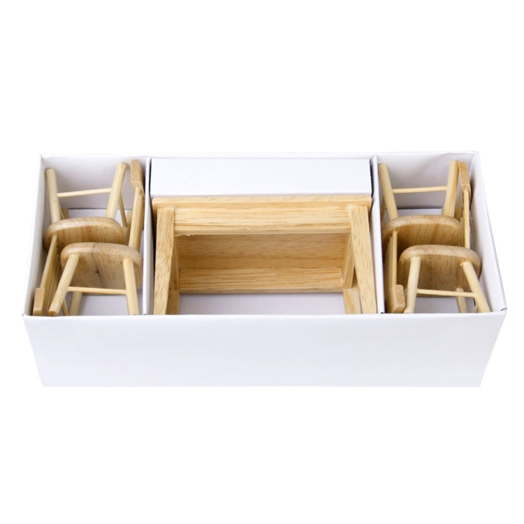 Mini dollhouse dining set pieces in box: table and chairs, light wood