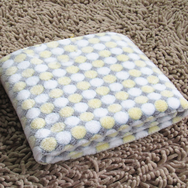 Flannel pet blanket with pastel yellow and white dot pattern, soft fuzzy top, folded