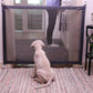 Portable folding pet fence gate with mesh panels and dark frame, room divider for dogs