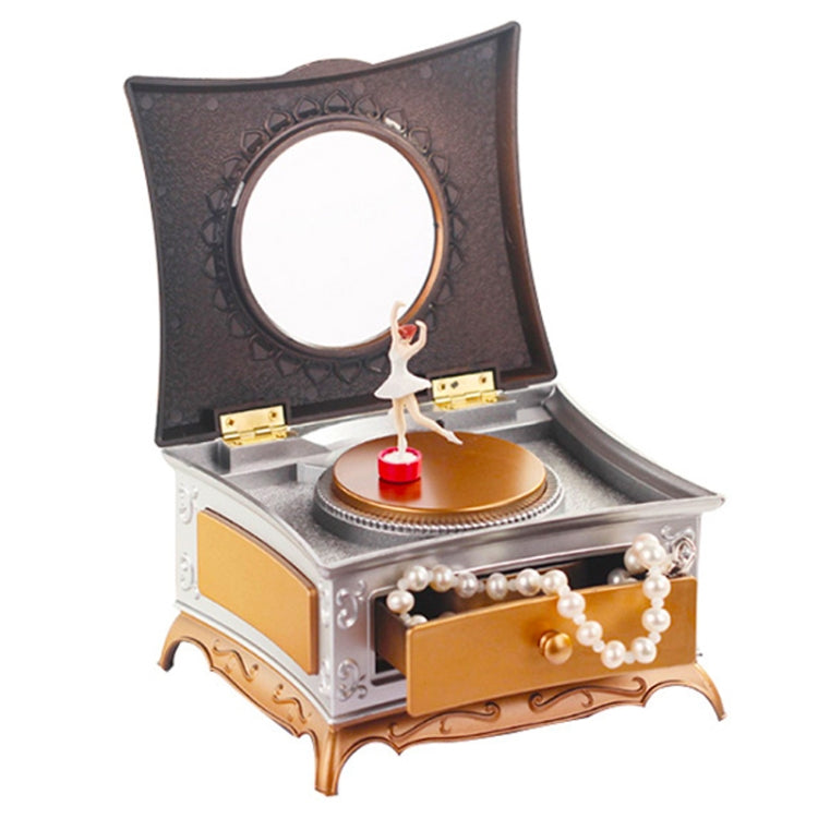 Rotating girl music box with mirror, open drawer, pearl trim, dark lid and gold base