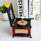 Rotating girl music box with open mirror lid and gold disc, red drawer front