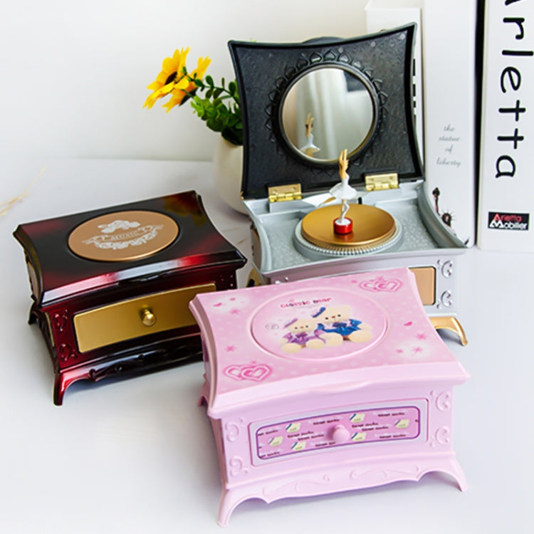 Rotating girl music box with open mirror lid, gold and dark interior, disc with candle stand