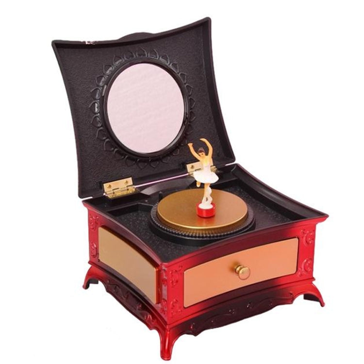 Rotating girl music box with mirror, open lid and disc, red base with gold drawer