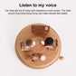 Wooden rotating music box base with visible mechanism, seated dolls, pink accents