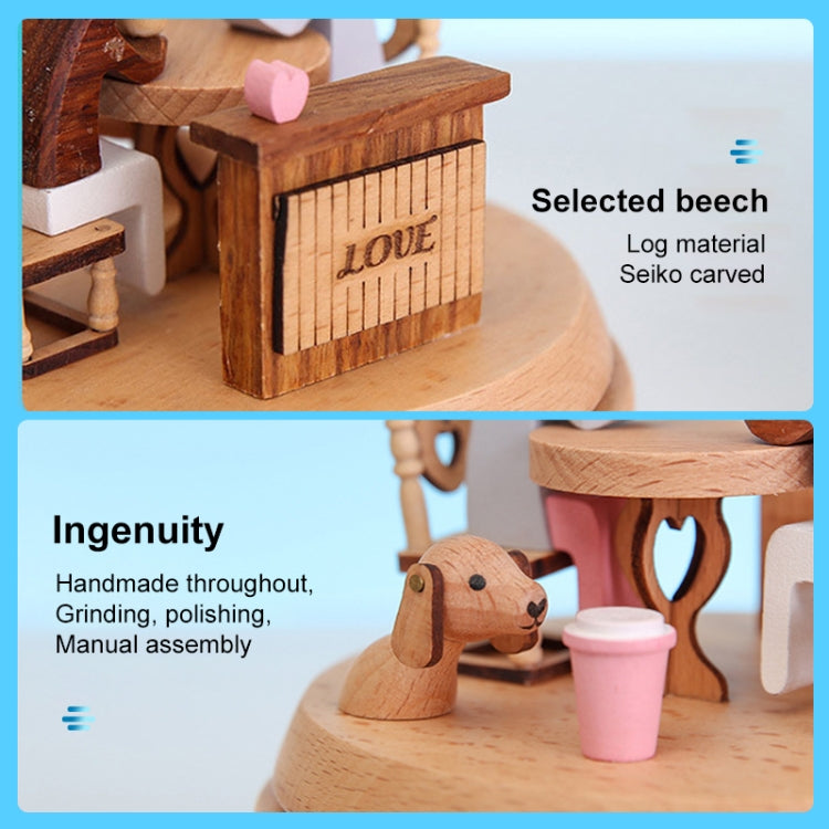 Wooden rotating music box detail: carved 'LOVE' panel, pink block, polished wooden base