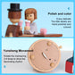 Wooden rotating music box detail with figures and round motion plate, hand-polished wood
