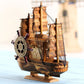 Wooden sailboat model decoration with compass wheel, three masts, and display base