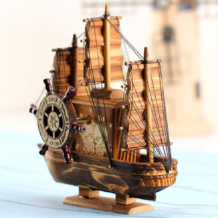 Wooden sailboat model decoration with compass wheel, three masts, and display base