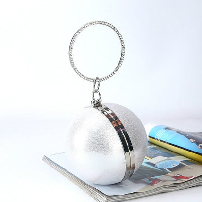Silver spherical evening bag with ring handle and chain clasp, PU exterior