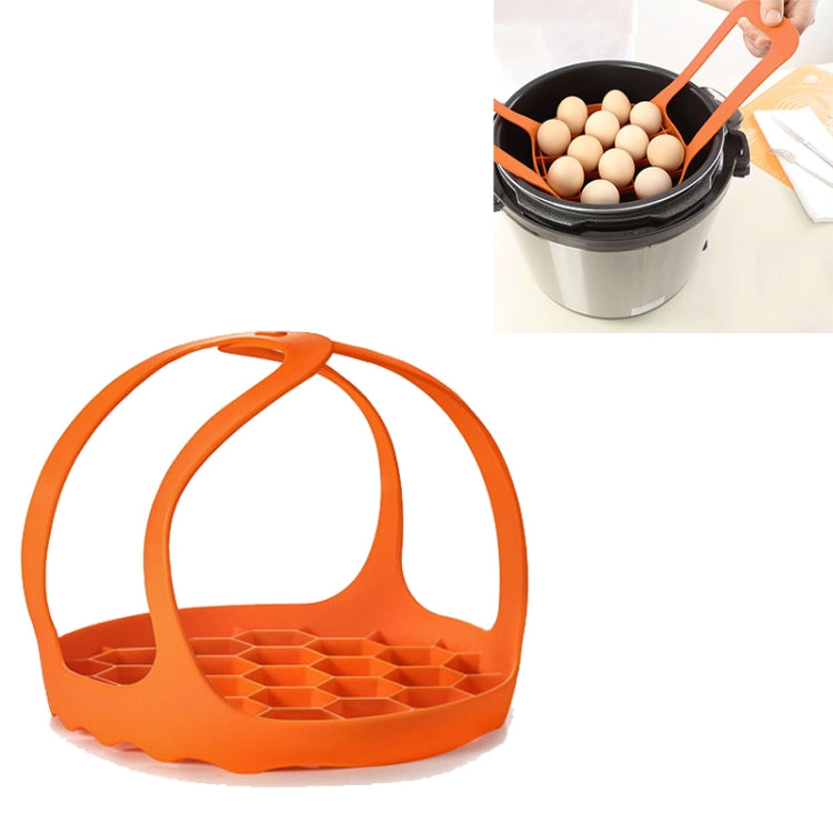 Orange silicone steamer egg cooker basket with arched handle and raised egg tray