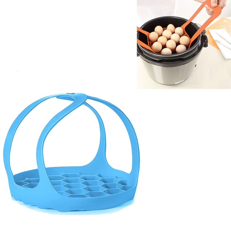 Light blue silicone steamer egg cooker basket with arched handle and raised egg tray