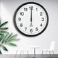 WiFi wall clock with black rim, white face, and black hour and minute hands