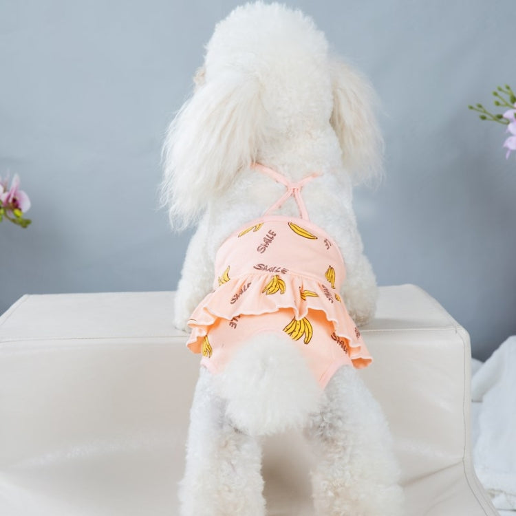 Pink banana-printed dog pants on a standing dog, showing back straps