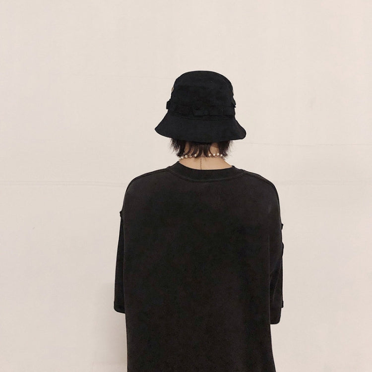 Black wide-brim bucket hat worn with back view
