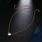 Gold-tone short necklace with heart-shaped crystal pendant