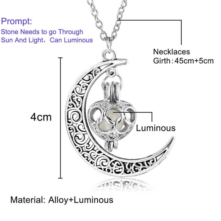 Crescent moon charm necklace with filigree edge and green glowing gem pendant, silver chain