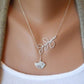 Silver leaf pendant necklace with small bird charm at center