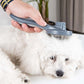Self-cleaning pet hair brush comb with needle bristles, used on a small white dog