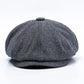 Octagonal snap beret hat in blue-gray herringbone pattern, pinched top