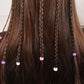 Finished three-strand braids with small pink and white hair ties