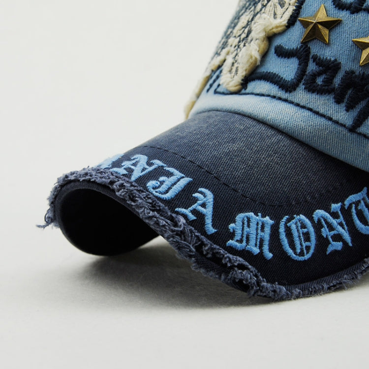 Denim baseball cap with embroidered letters and star rivet on brim, dark blue