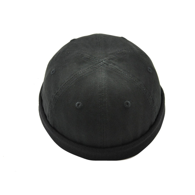 Foldable brim hat in dark gray with small side grommet details