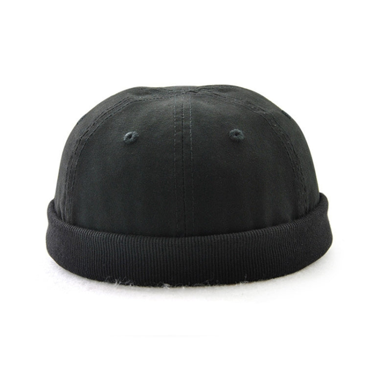 Foldable brim hat in black with small grommet vents and stitched panel seams