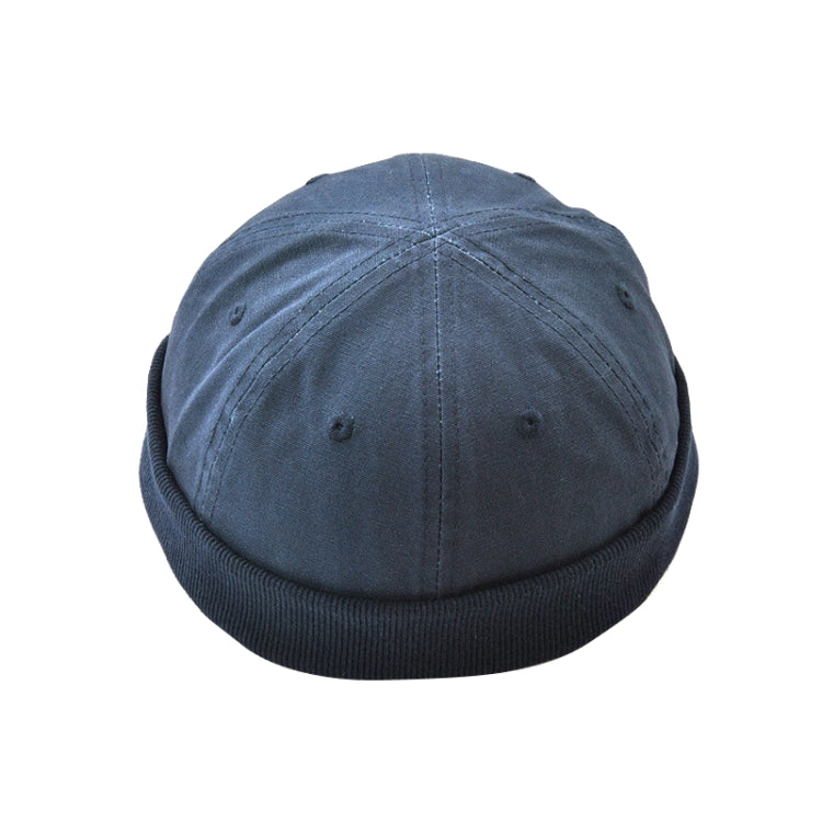 Foldable brim hat in dark blue with small grommet vents and stitched crown