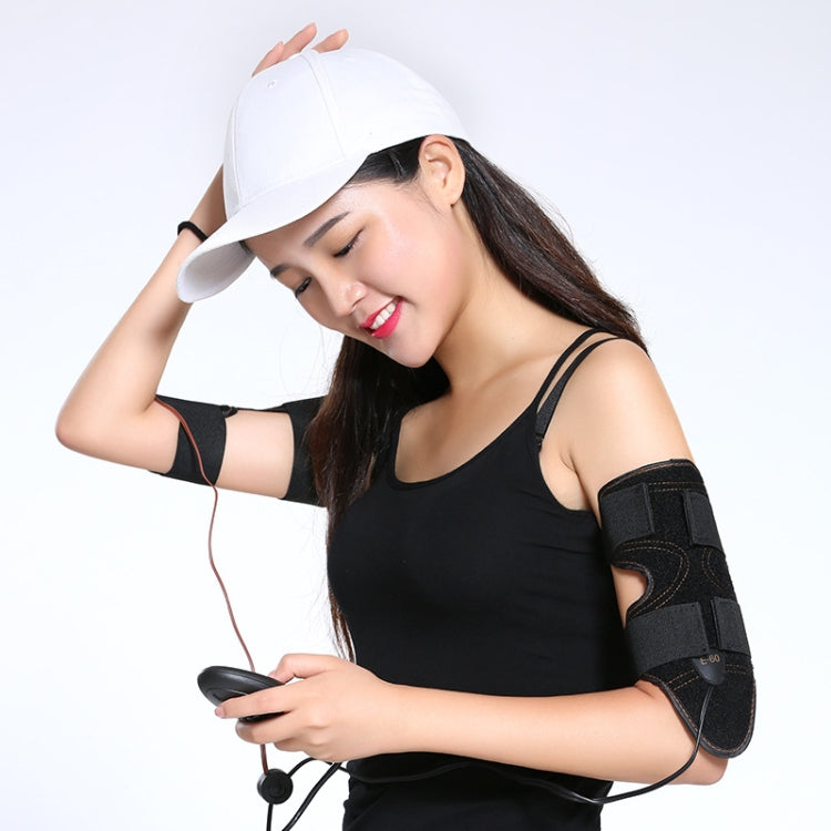Woman wearing black arm slimming cuffs and holding remote controller
