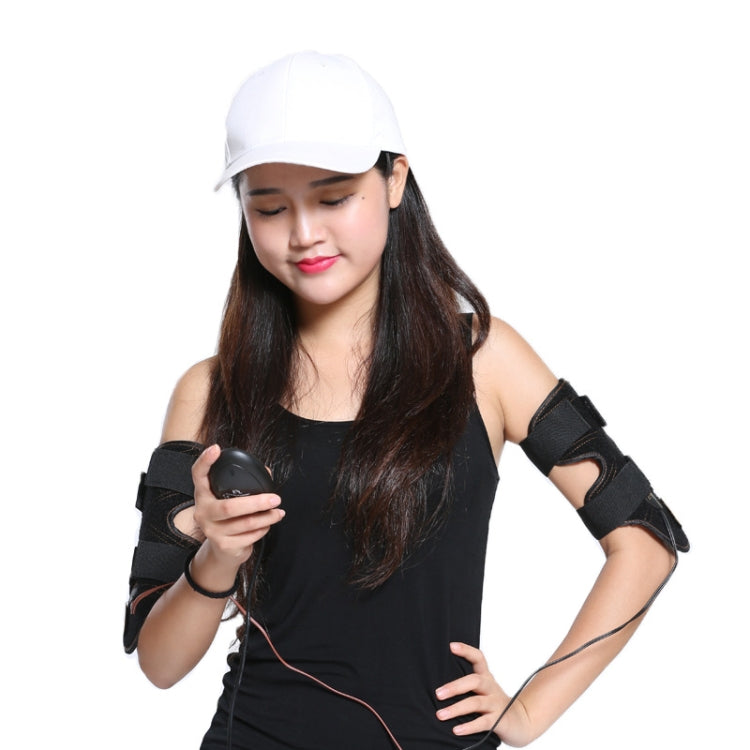 Woman wearing black arm slimming massager cuffs with remote controller