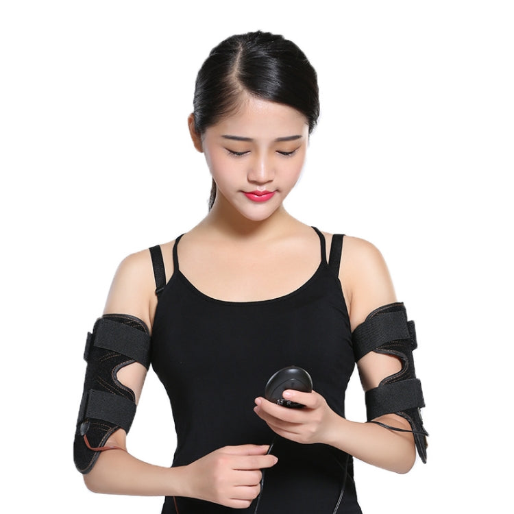Woman in black tank top wearing arm slimming cuffs and holding remote