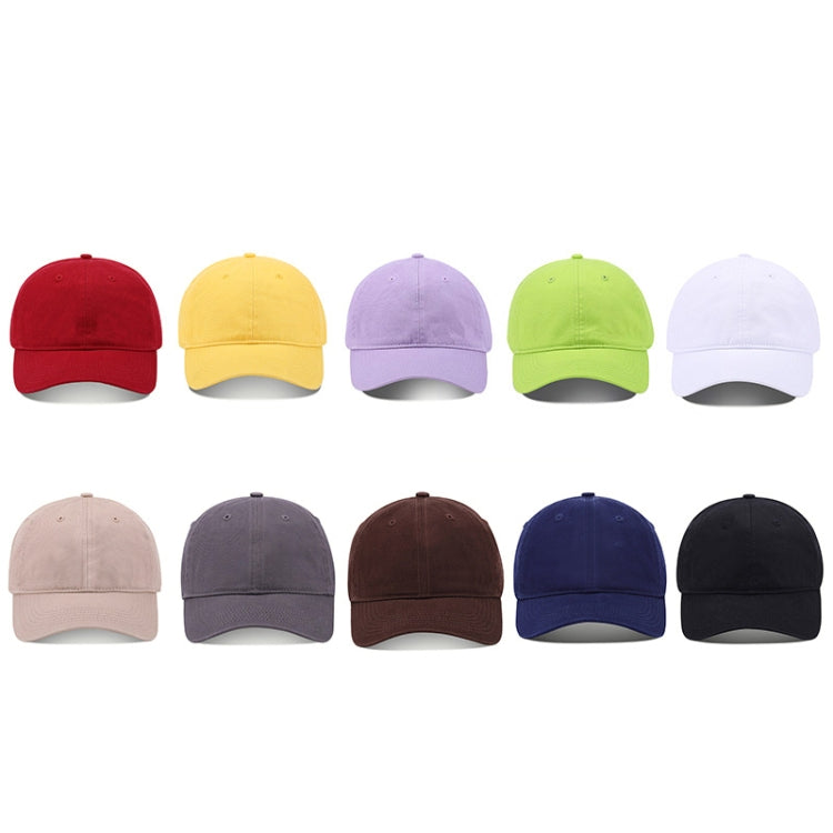 Assorted solid-color baseball caps in multiple colors, curved brims