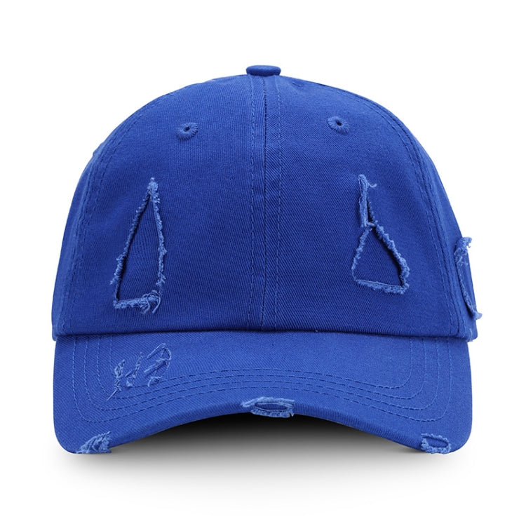 Washed blue baseball cap with distressed triangle applique and ripped brim