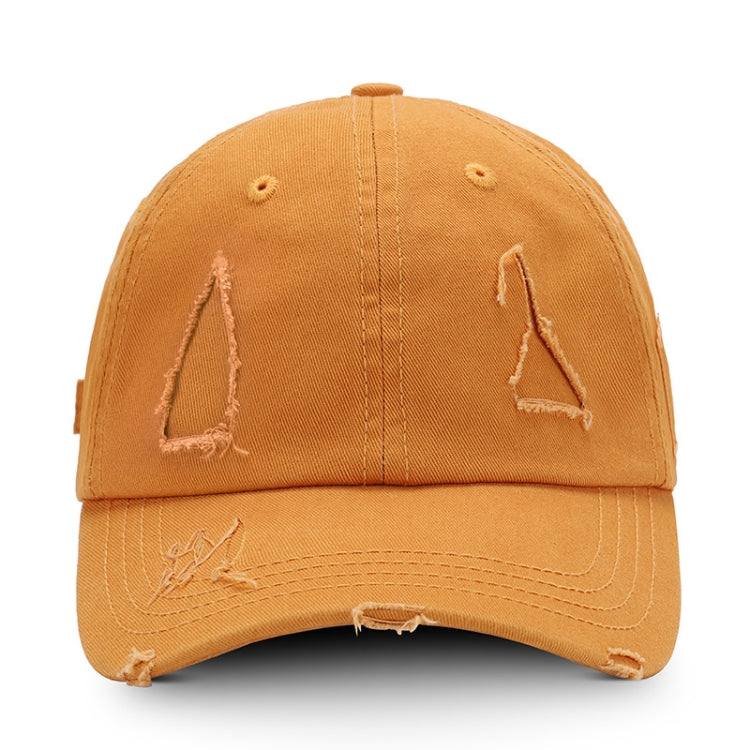 Washed tan baseball cap with distressed triangle applique and torn brim