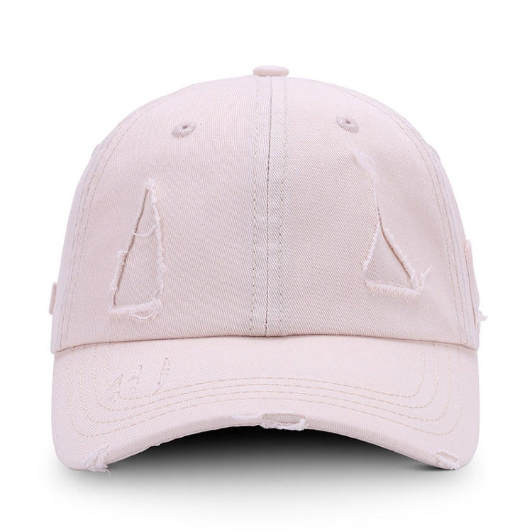 Washed cream baseball cap with distressed triangle applique and torn brim