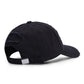 Washed black baseball cap shown from side with distressed patches and torn brim