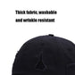 Washed black baseball cap with embroidered triangle logo and curved brim