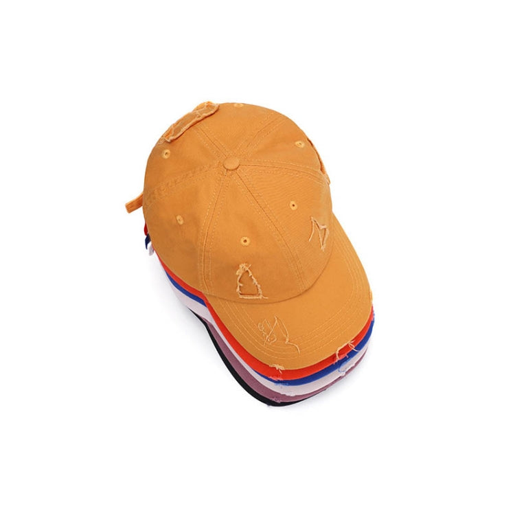 Washed orange baseball cap with distressed brim and embroidered triangle logo