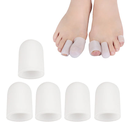 Set of white toe corn protectors, closed toe caps shown on feet