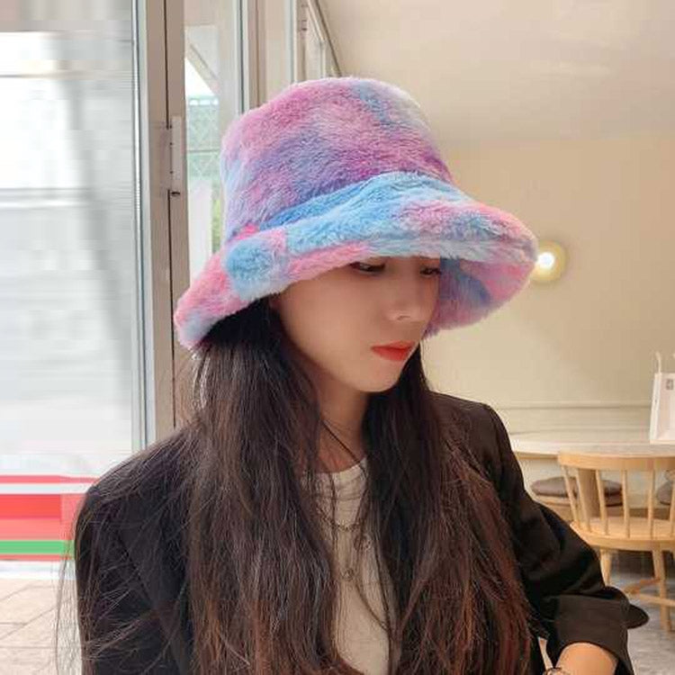 Plush rainbow fisherman bucket hat with wide brim, pastel pink and blue.