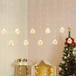 Warm white LED globe curtain lights hanging in rows with a small Christmas tree