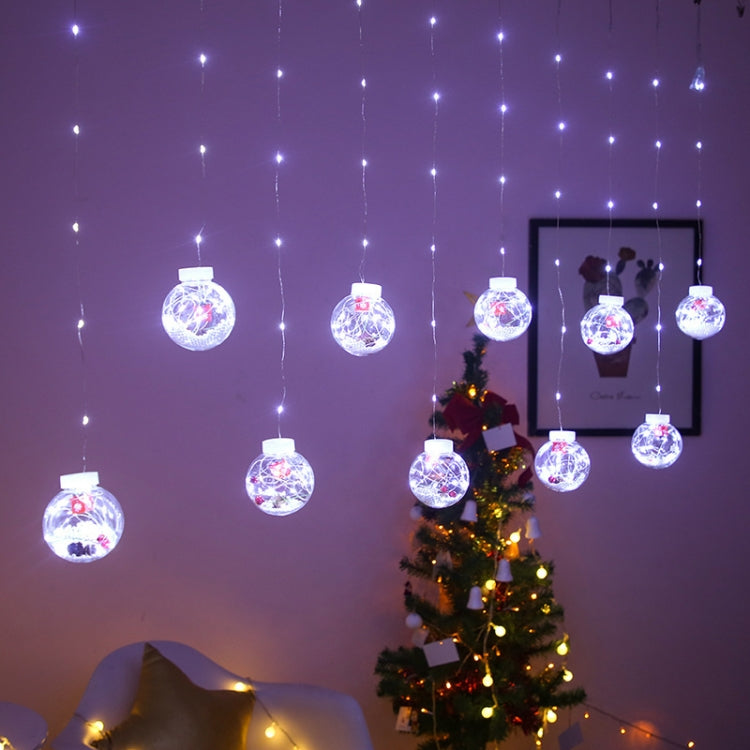 Colorful LED globe curtain lights with clear bulbs glowing purple and blue