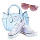 Light blue tote bag, sneakers, and pink sunglasses decorated with rhinestone sticker details