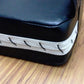 Target pad edge with white trim and stitched panel detail