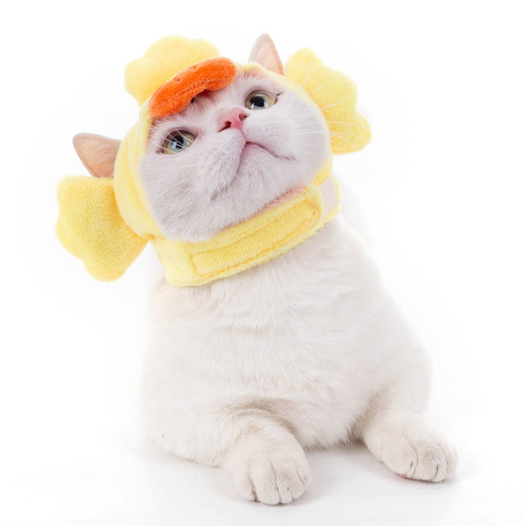 Yellow pufferfish-style pet head cover with orange nose detail and soft fin sides.