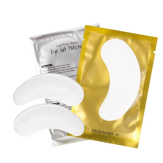 Under-eye eyelash extension gel patches, white nonwoven half-moon pads and gold wrappers