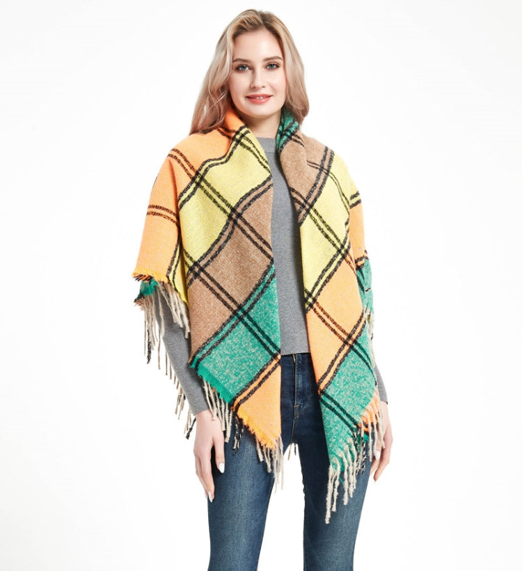 Fringed plaid square scarf in orange, tan, yellow, and teal with tassels