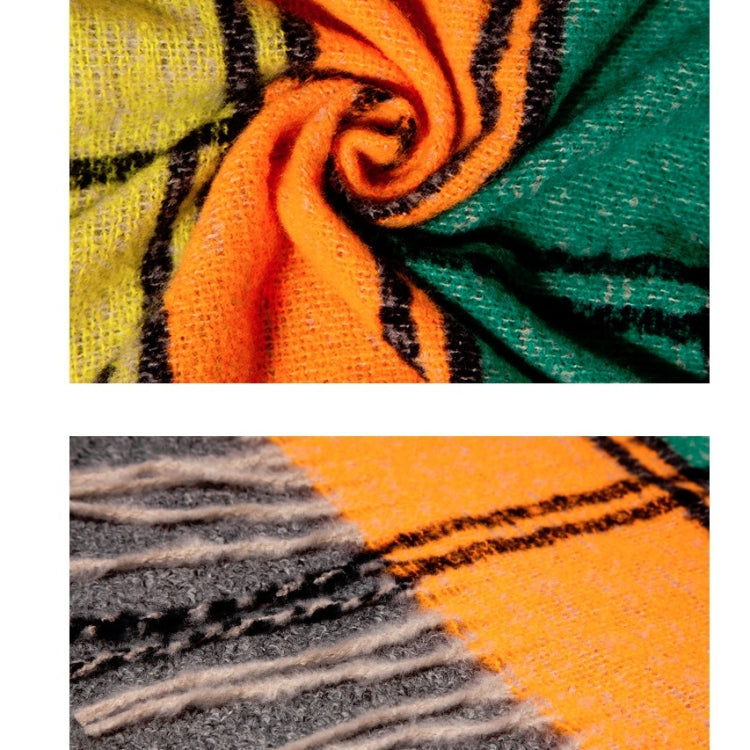 Plaid scarf fabric close-up, orange and teal stripes with fringed edge