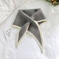 Two-color knitted wool mini triangle scarf, heather gray with cream trim and pointed ends