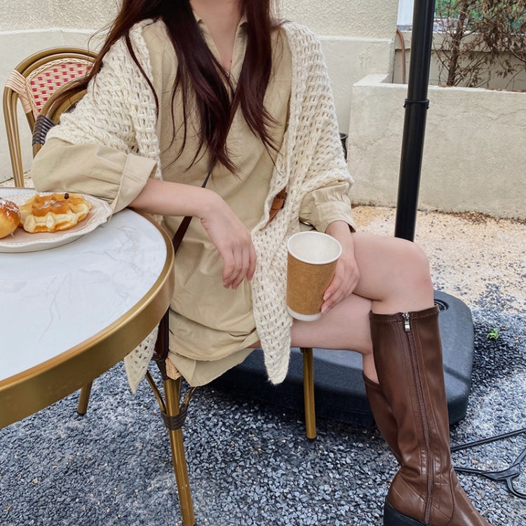 Cream knitted triangle shawl scarf with leather buckle strap and draped fit